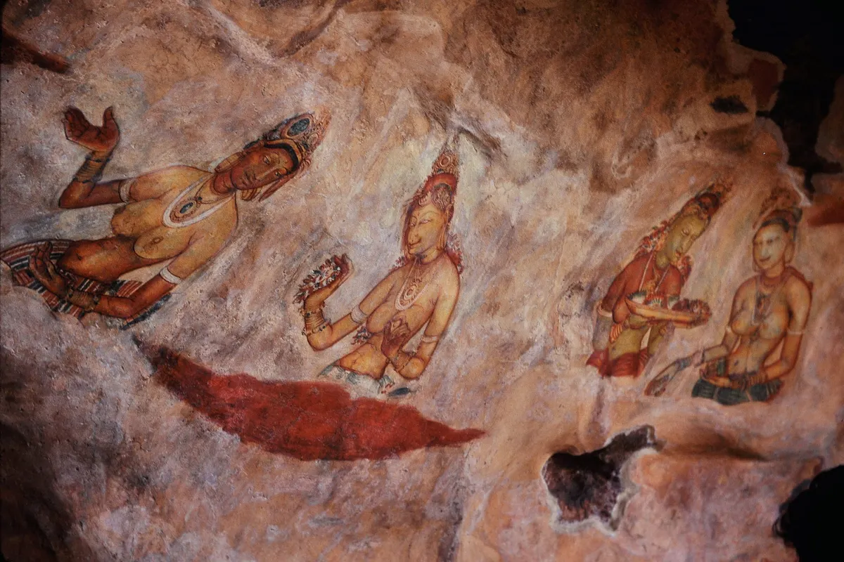 The cloud-maiden frescoes in their sheltered gallery on Sigiriya’s rock face